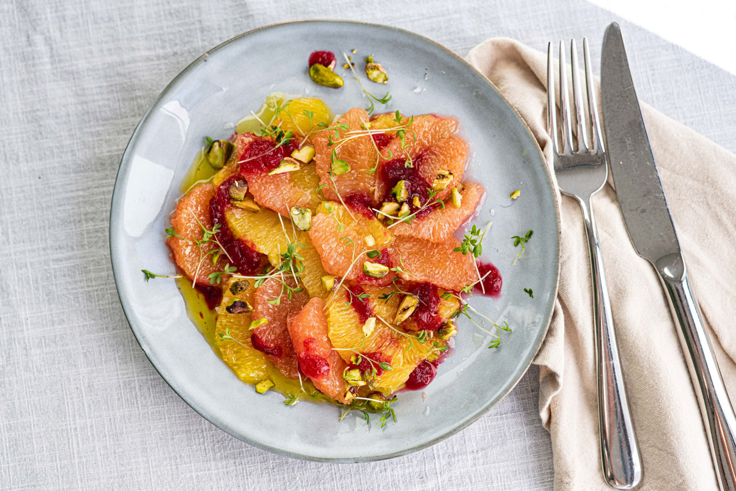 Citruscarpaccio met cranberrysaus