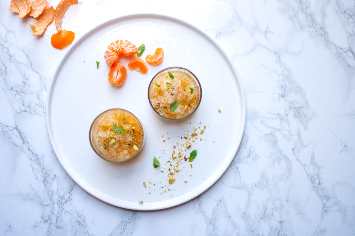 Granita van mandarijnen met verse munt en pistachenootjes